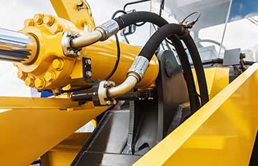 Closeup of the main hydraulic piston of a front loader